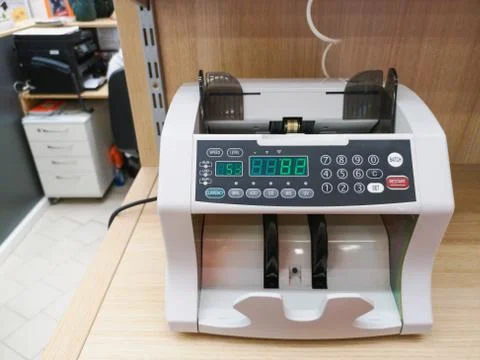 The counting machine counts many bills for one hundred American dollars of a new Stock Photos