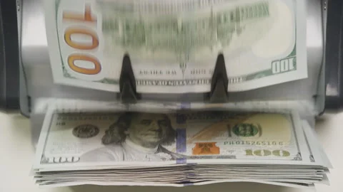 Counting machine processing stack of hundred-dollar bills Stock Footage 301287209