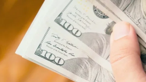 Counting Money Checking a Wad of One Hundred Dollar Notes Stock Footage 319985201