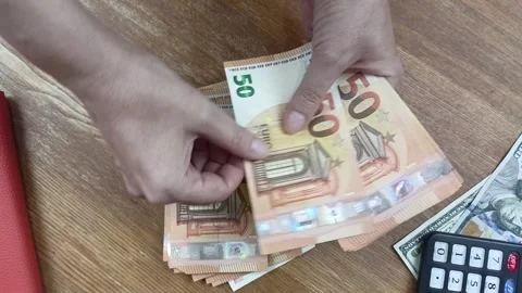 Counting money over the table close-up from above. Stock Footage 294669127