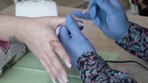 Counting nails Professional LED Uv Gel Nail Polish in the salon. Closeup Stock Footage 74105788