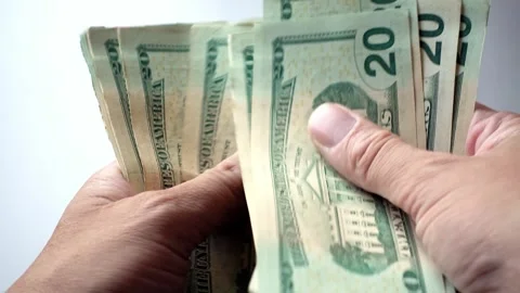 Counting Out Stack Of 20 Dollars American To Pay For Costly Items Stock Footage 247418543