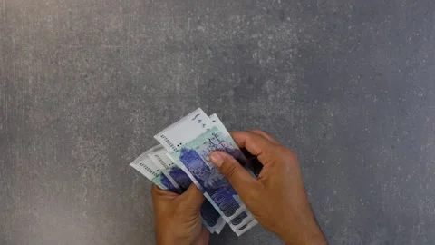 Counting Pakistani 1000 rupees notes. Saving and investment concept. Video stock 305994923