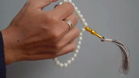 Counting with prayer beads Stock Footage 289028631