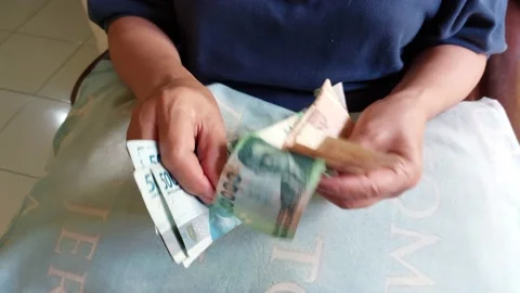 Counting rupiah banknotes of various denominations Stock Footage 231455410