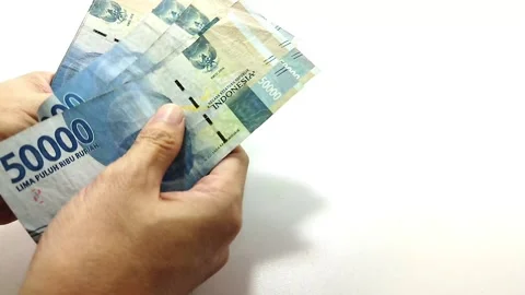 Counting Rupiahs Video stock 219552721