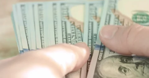 Counting a stack of hundred dollar bills Stock Footage 321750768
