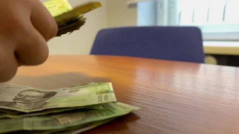 Counting a stack of money Stock Footage 252514583