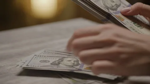 Counting a stack of US dollar bills Stock Footage 277137077