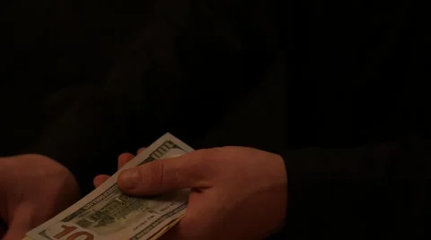 Counting the US dollars banknotes close up on black background Stock Footage 57668512