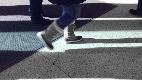 Countless feet passing through a doorway Stock Footage 336249962