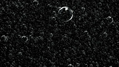 Countless soap bubbles are understood on a dark background. Video stock 125164780
