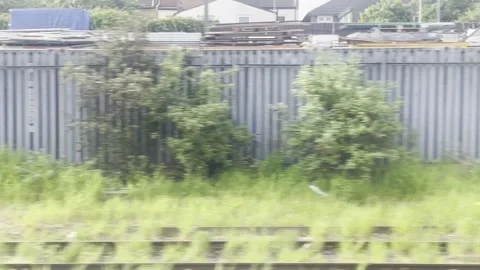Countrsyide whipping past on a train 库存影片 242530773