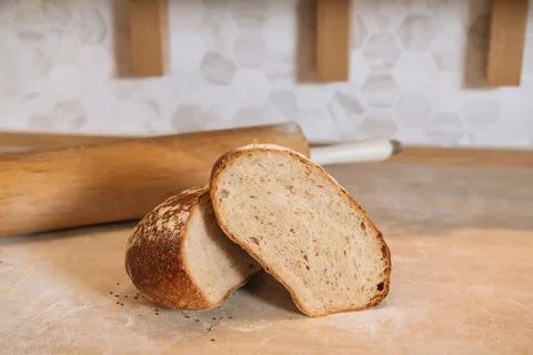 Country Bread Round Loaf of Rustic White Bread with Sliced Half isolated on.. Stock Photos
