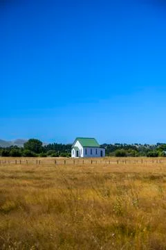 Country church and farm fields Stock Photos
