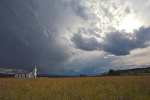 Country church with storm clouds Stock Photos