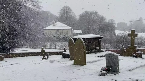Country churchyard graveyard cemetry burial snowing snowstorm blizzard Stock Footage 297303353