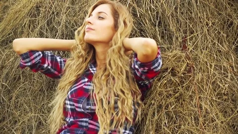 Country Girl Sitting In A Haystack Stock Footage 72236690