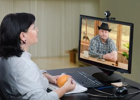 Country man learning immunization technique with remote GP 写真素材