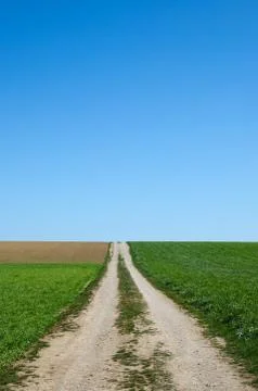 Country road to the fields Stock Photos