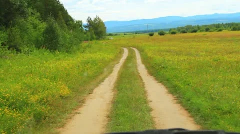 Country road in the fields. Shot through car windshield Vidéo 10719022