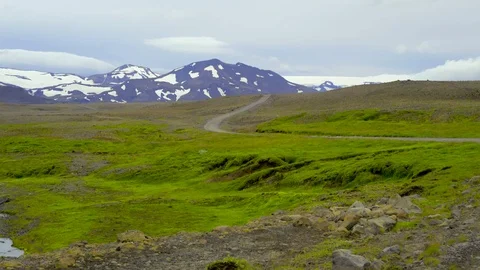 Country road passing through rolling landscape Stock Footage 73010718