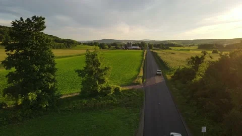 Country road at sunset Stock Footage 169916708