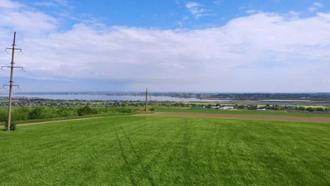 Countryside. Green field. A river flows in the background Stock Footage 128711729