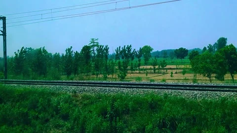 Countryside Landscape Viewed from Train Window During Travel Stock Footage 327999736