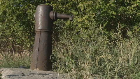 Countryside. Rusty water column in the village. Sunny day Video stock 80206053