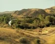 Countryside seen from moving train SD Footage