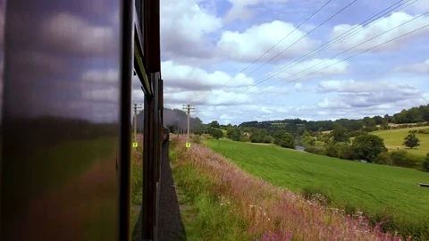 Countryside view from carriage of classic steam train Stock Footage 80285355