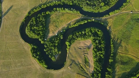 Countryside. A wide channel that flows between fields and forests Stock Footage 168692734