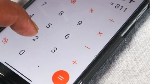 Counts on a calculator of smartphone Stock-Footage 332883658