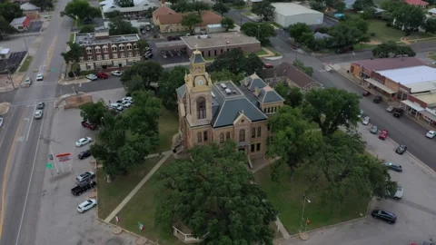 County courthouse, stores and streets with light traffice, Llano, Texas, USA Stock Footage 142108659