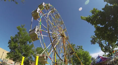 County Fair Ferris Wheel Moving In Slow Motion Stock Footage 34694207