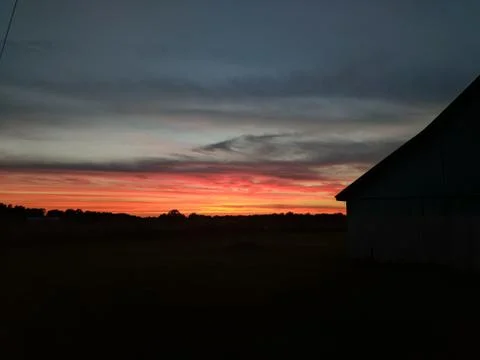 County Sunset with an old Barn Stock Photos