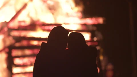 Coupe hugging near a huge fire Stock Footage 267012463