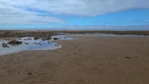 A coupe walking along the beach Stockbeeldmateriaal 202068234