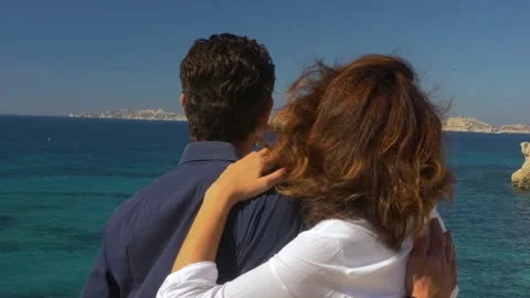 A couple admiring the view at the seaside Stock Footage 146692685