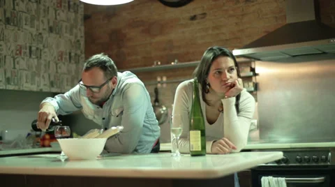 Couple after quarrel drinking wine in the kitchen Stock-Footage 36640525