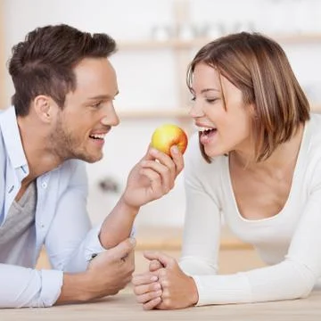 Couple with apple Stock Photos