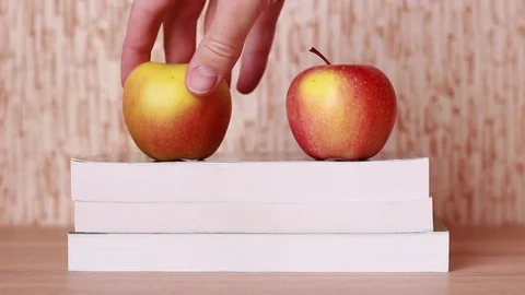 Couple of apples on books Stock Footage 83030103
