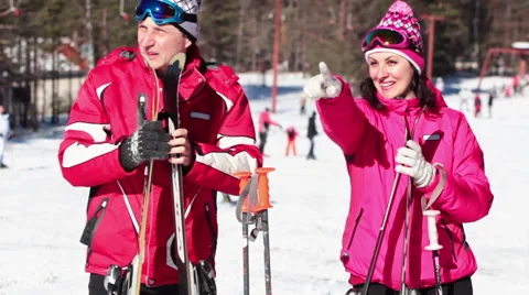 The Couple are Preparing to Skiing on a Beautiful White Mountain Stock Footage 60249958