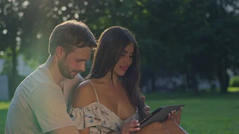 The couple are together and communicate with friends Stock Footage 156508089