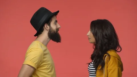Couple arguing, having intense argument conversation, indian girlfriend smiling Stock Footage 115782796