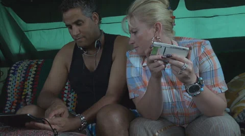 Couple arguing using tablet digital iphone playing blonde woman african man Stock Footage 27964664