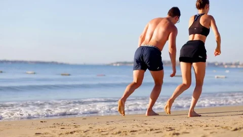 A couple of athletes engaged in exercise Stock Footage