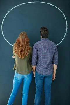 Couple, back and speech bubble on chalkboard for decision, announcement and.. Stock Photos