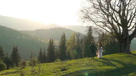 Couple on the background of mountains Stock Footage 76248654